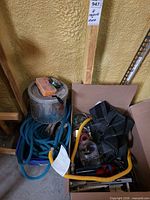 Lot overview showing bucket, ropes, jars, belt and tools in box