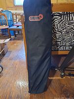 Full view of black Sherpa M2 carry bag upright