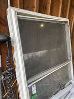 Front view of aluminum single-hung window with screen