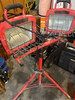 Full view of red tripod light with both heads attached