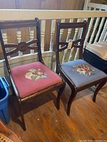 Both dining chairs side by side showing overall design and upholstery colours