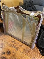 Mirror wrapped in bubble wrap and tape