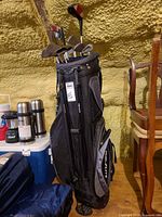 Full view of golf bag with clubs