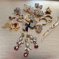 Group shot of all earrings, pendant and components