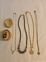 All necklaces, pendant and trinket box laid out
