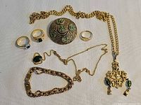 All eight jewellery pieces laid out