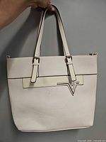 Front view showing overall style, V accent and handles