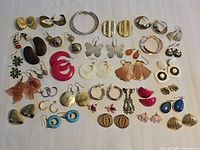 Full layout of 33 earring pairs