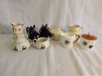 All five cream and sugar sets displayed