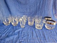 Full set of eleven glasses on blue cloth