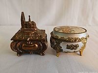 Both jewellery boxes front view showing shapes, finishes and decorative details