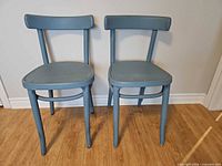 front view of both blue bentwood chairs