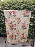 Full view of first floral barkcloth panel hung on rack