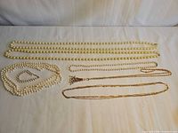 Overview of all necklaces and bracelet laid out