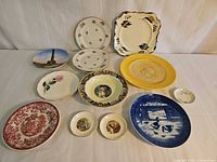Group shot of all eleven plates and three butter pats