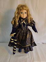 Full front view of porcelain doll standing