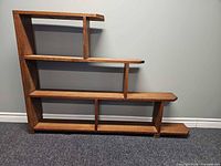 Front view of stepped oak bookshelf