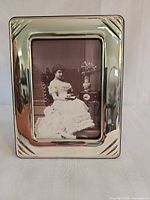 Front view of sterling silver picture frame with sample photograph inserted