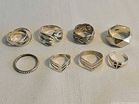 All eight sterling rings grouped for overall view