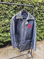 Front view of navy Air Canada parka on rack