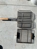 Flat grill basket closed beside deep basket