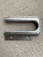 front view showing stamped text and mounting flange