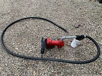 Overall view of pump, hose and filter on ground