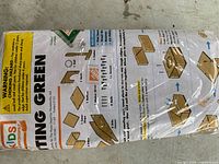 Front of sealed Kids Workshop Putting Green kit showing instruction sheet and parts list