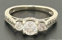 Front view of ring showing center and side diamonds