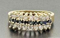 Front view showing three-row sapphire and diamond arrangement