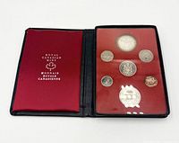 Open case showing all seven proof coins in plastic holder and satin interior logo