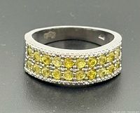 Front view of sterling silver band with two rows of yellow citrines