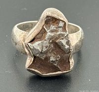 front view of sterling silver ring showing meteorite