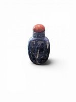 Front view showing blue sodalite body and red stopper