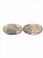 Front view of both oval raven earrings