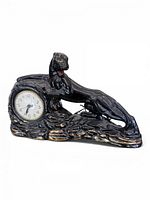 Full view of black ceramic panther clock