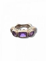Front view showing three amethyst stones and ornate silver setting