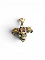 Front view of silver and brass skull pendant with red CZ stones and bail