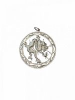 Front view of open-work sterling silver dragon pendant