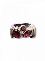 Front view showing three garnet stones and silver setting