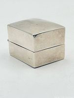 Three-quarter view of closed sterling silver ring box