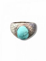 Front view of sterling silver ring with turquoise cabochon
