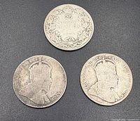 Obverse of two coins and reverse of one coin