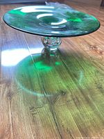 side view showing green platter and clear bubble pedestal