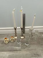 Group shot of all eight candle holders on floor