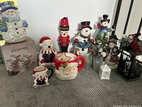 Group shot showing most items including mugs, jars, figurines, tumblers and lanterns