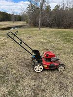 Side profile of Toro Recycler mower outdoors on grass