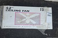 Front of sealed box showing model details and image of the 42" ceiling fan