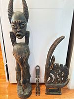 Group shot of all three wooden sculptures