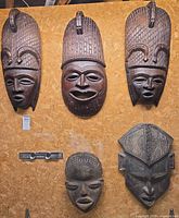 Front view of all five masks mounted on board